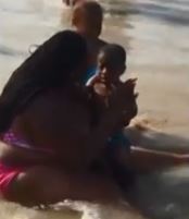 Video: Mom slaps child that is terrified of beach waves