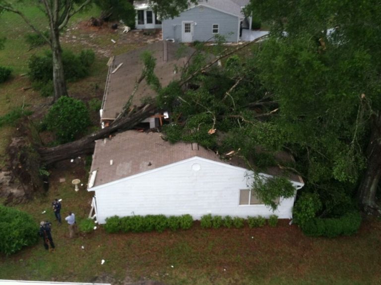 A tornado and fallen trees caused major damage to homes