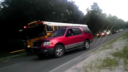 Firefighter who drove around stopped school bus will be ticketed