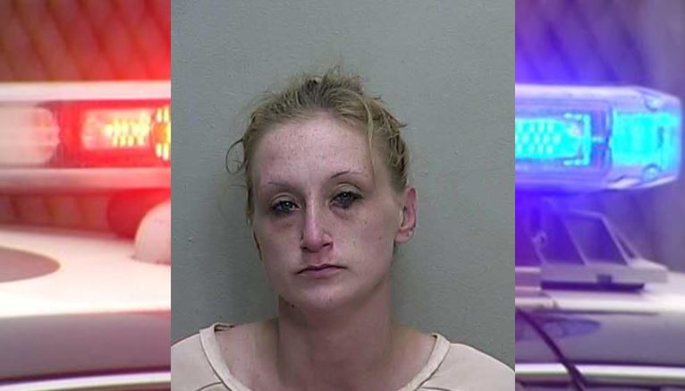 Woman confronted juveniles with pipe, arrested