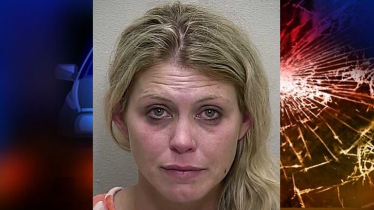 Woman arrested after witnesses pulled her from an overturned vehicle