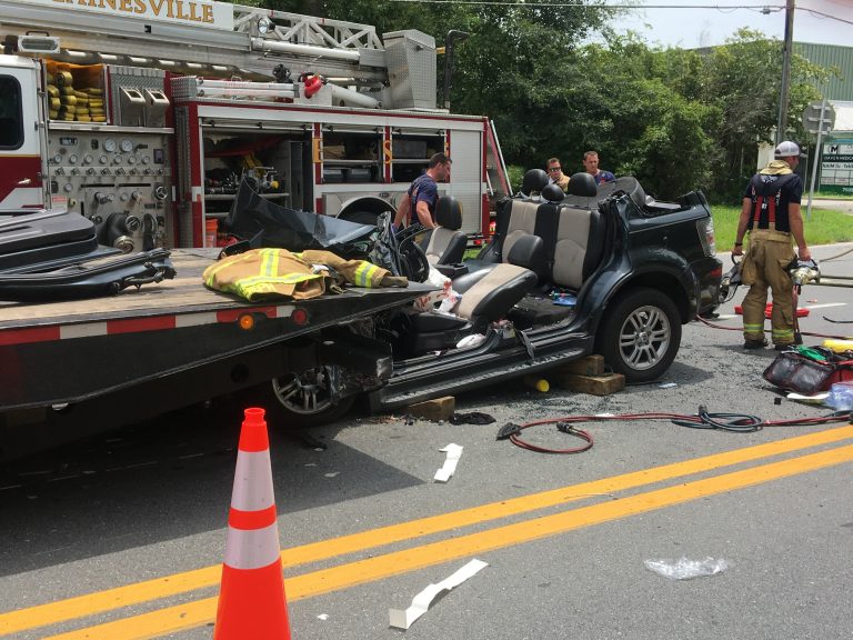 Woman rushed to hospital after she slammed into semi-trailer