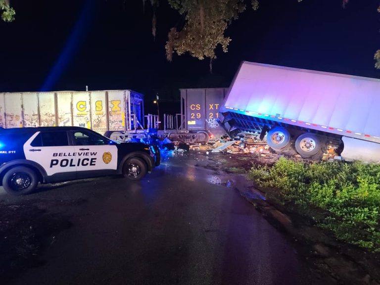 CSX train slams into semi after it gets stuck on tracks